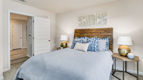 The Cali guest bedroom three with luxury carpet