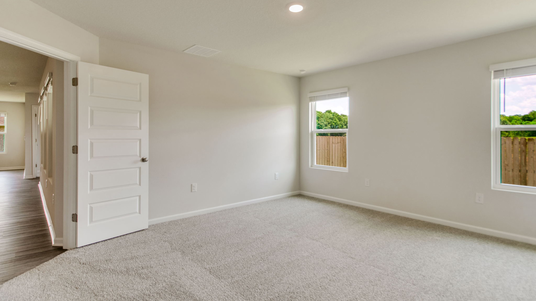 The Sawyer floorplan primary bedroom with carpet throughout