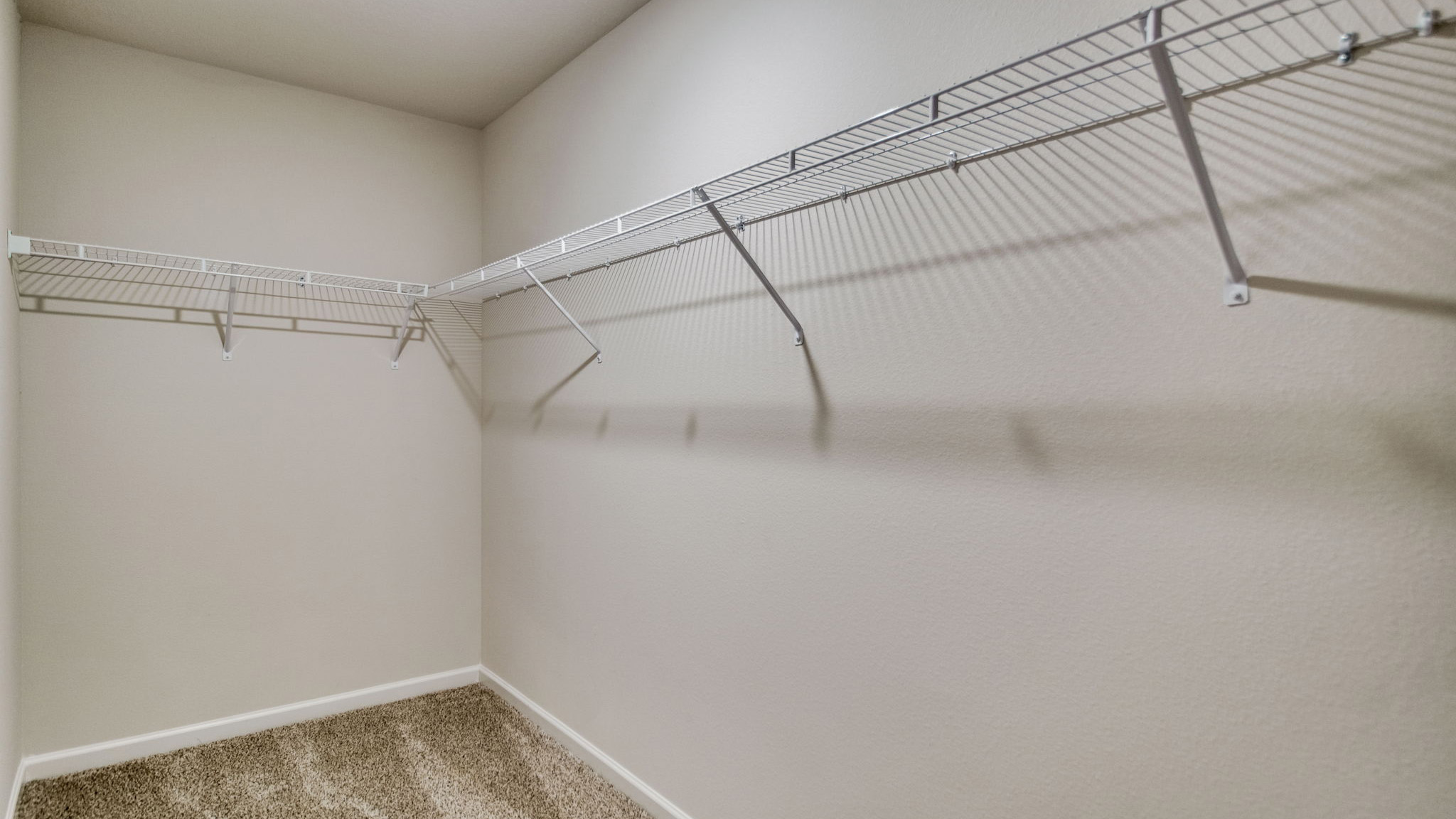 The Sawyer floorplan primary bedroom closet with wire shelving