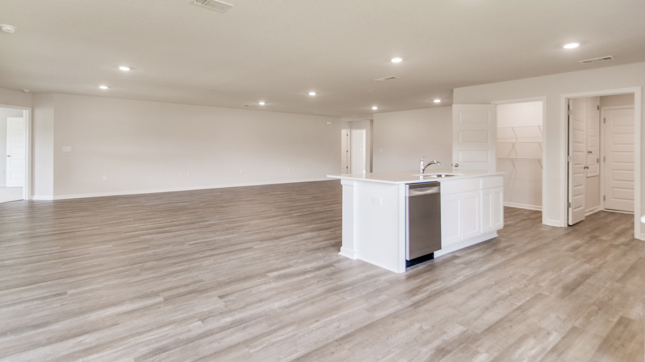 The Sawyer floorplan open concept main living space with EVP flooring throughout