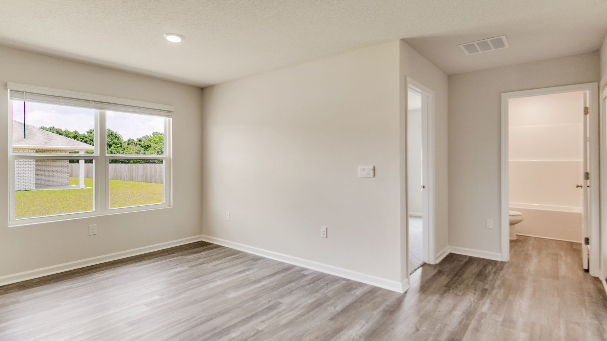 The Sawyer floorplan breakfast nook area and guest bathroom entrance