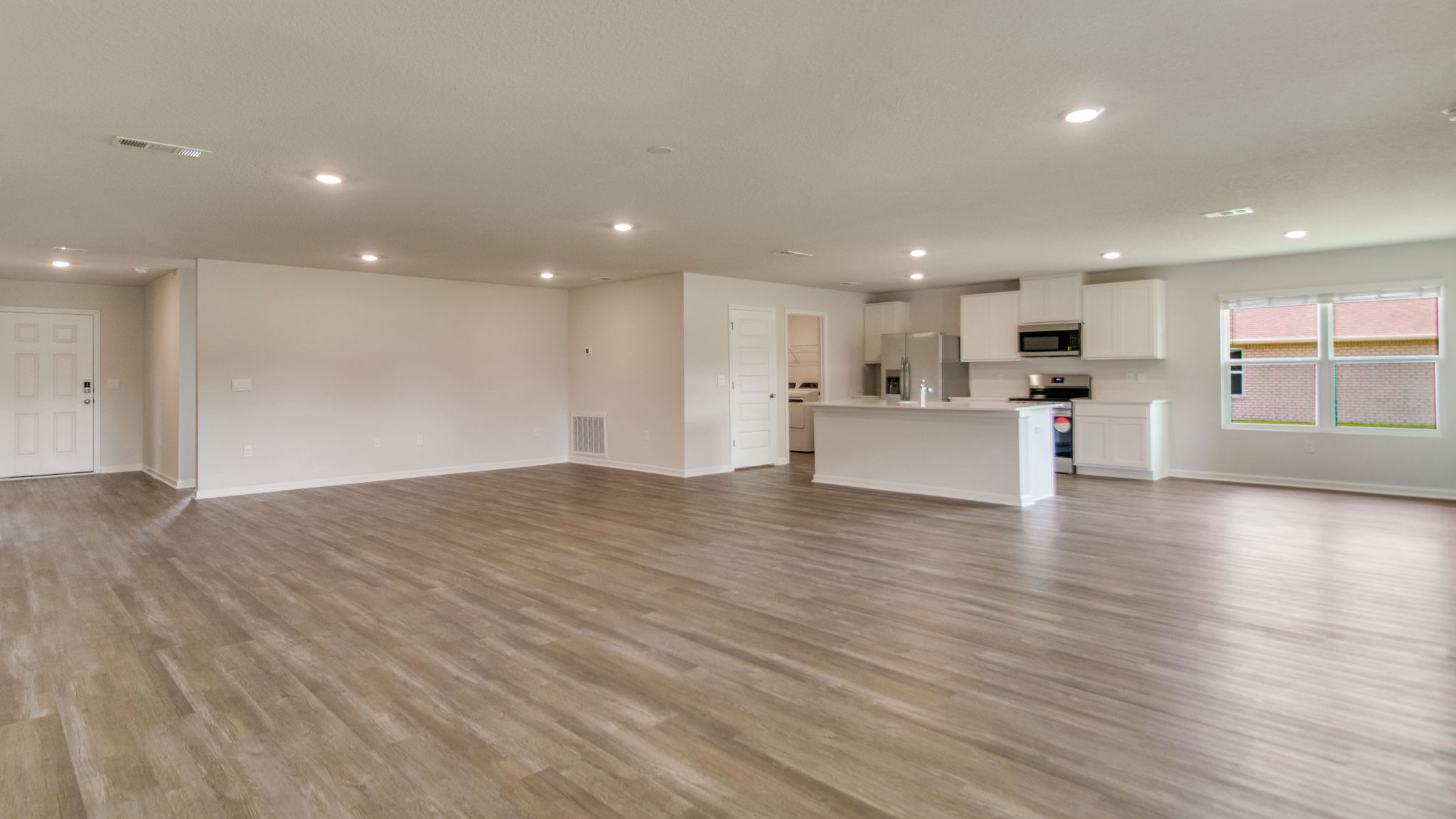 The Sawyer floorplan with an open concept kitchen, living room and dining room