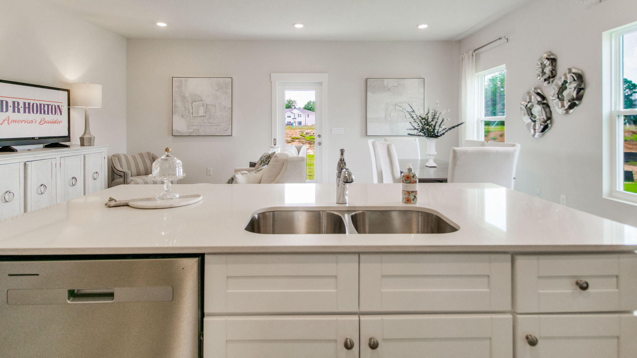 The Ozark floorplan dining room open into the kitchen and living room