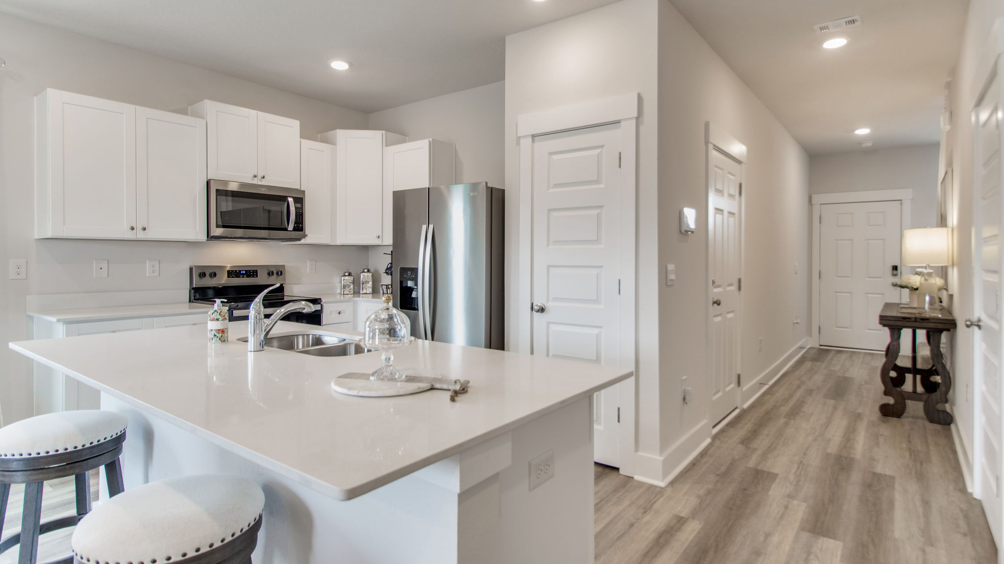 The Palm floorplan kitchen with white shaker style cabinets