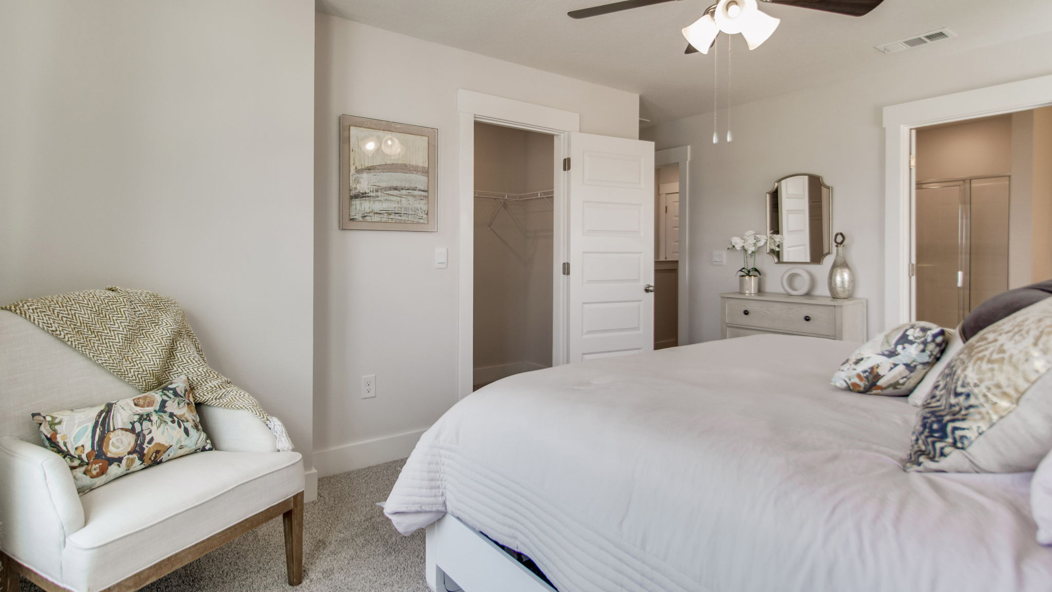 The Palm floorplan primary bedroom with carpet throughout