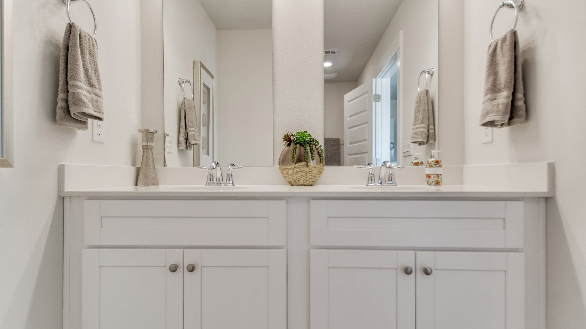 The Palm floorplan primary bathroom with dual vanity and quartz countertops