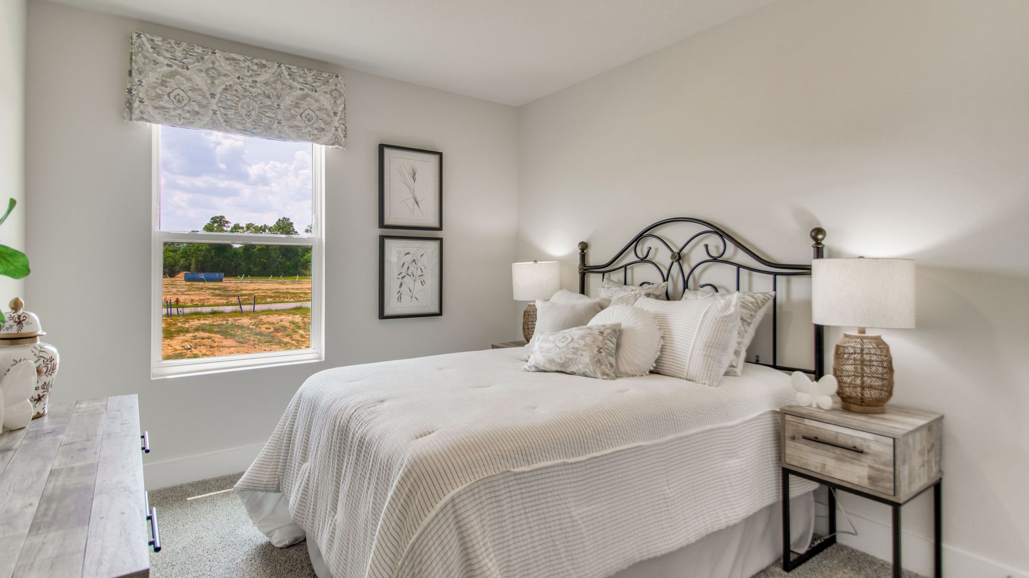 The Palm floorplan guest bedroom two with carpet throughout