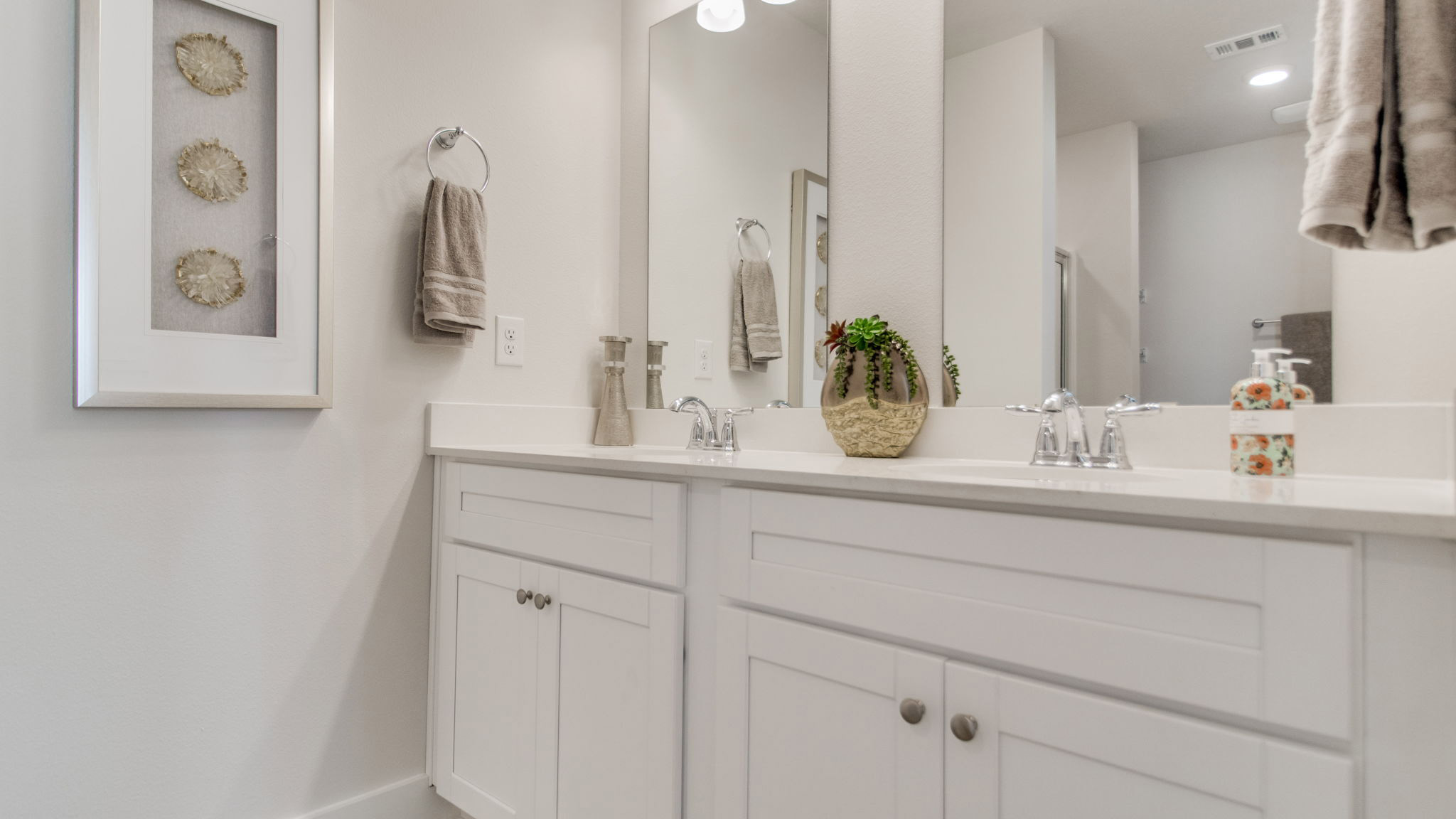 The Palm floorplan primary bathroom with dual vanity and quartz countertops