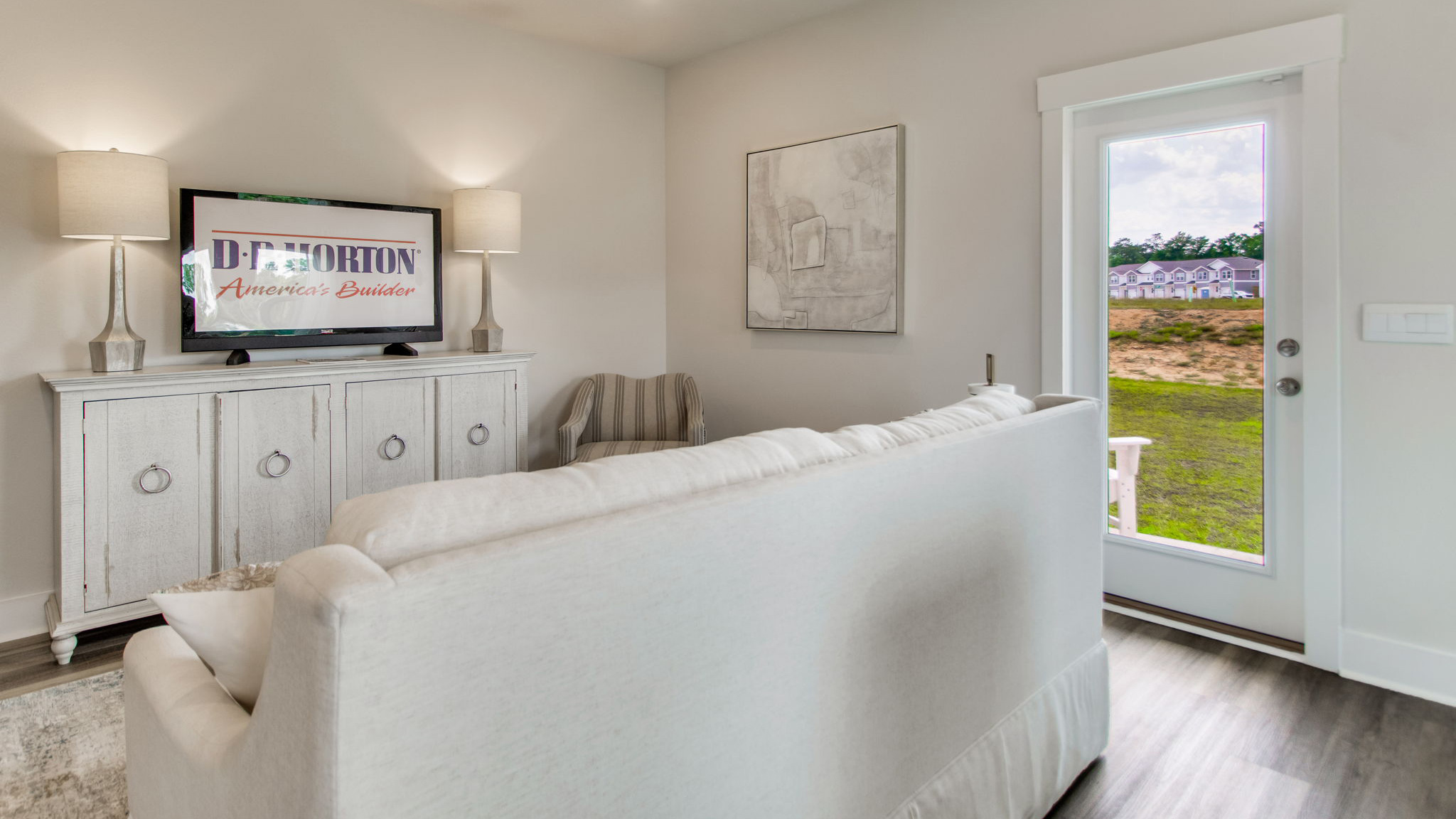 The Palm floorplan living room with back patio view