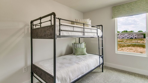 The Palm floorplan guest bedroom one with window view