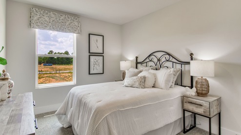 The Palm floorplan guest bedroom two with window view