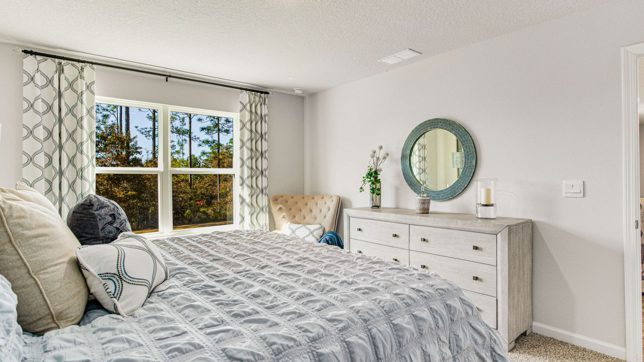 The Cali floorplan primary bedroom with carpet throughout