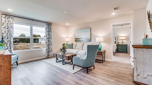 Cali model living room with large window