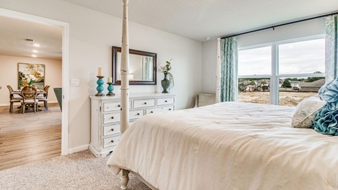 Cali model primary bedroom with large window