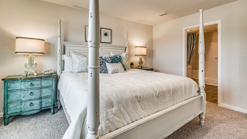 Cali model primary bedroom with luxury carpet