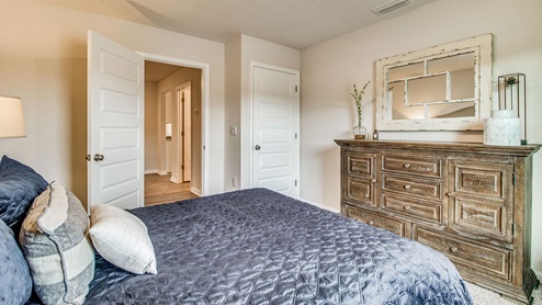 Cali model guest bedroom with luxury carpet