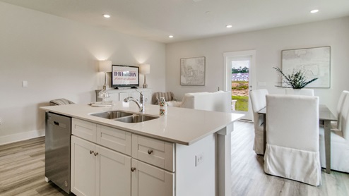 The Palm floorplan dining room with EVP flooring throughout