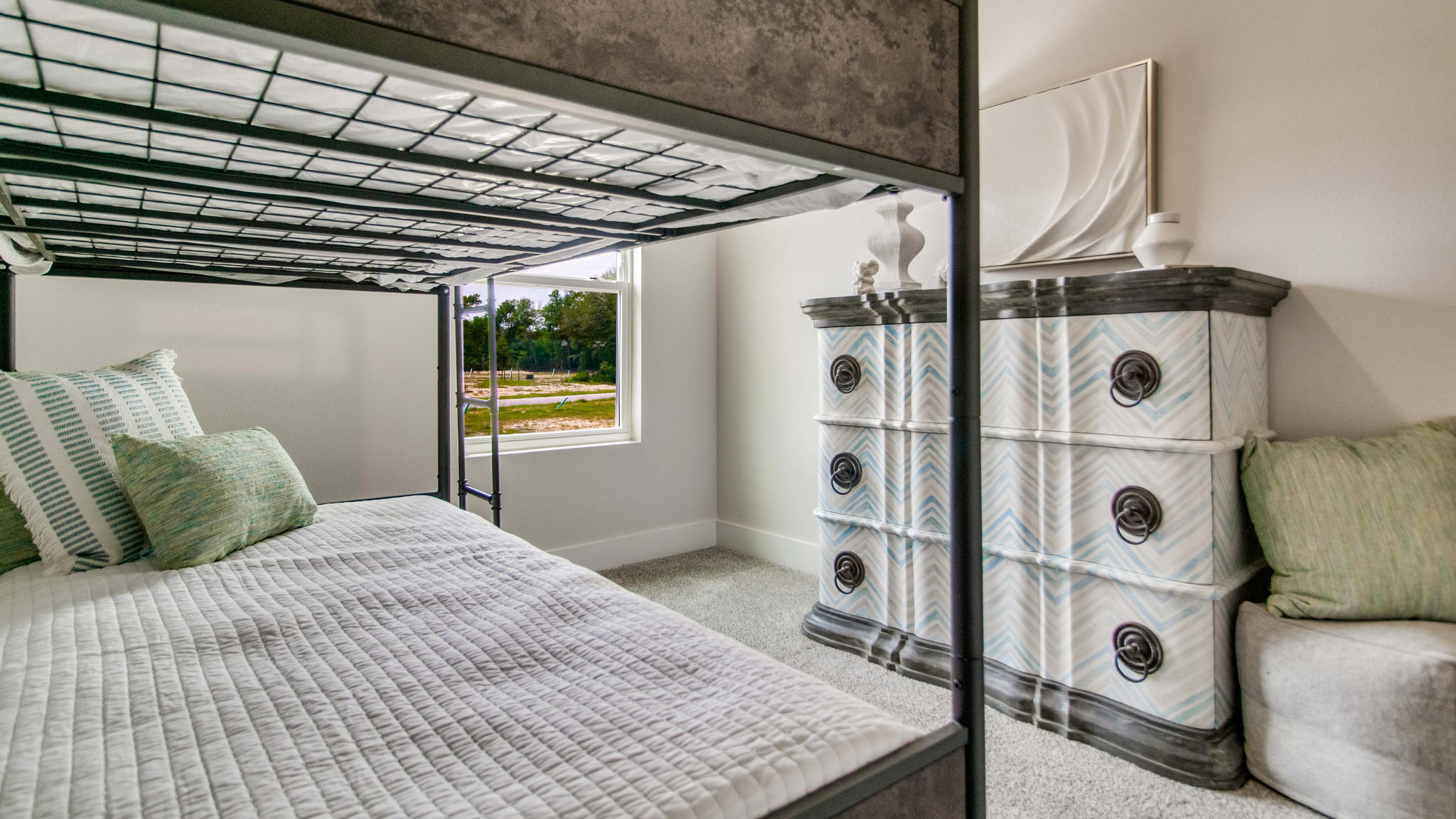 The Palm floorplan guest bedroom one with carpet throughout