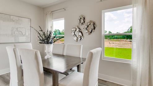 The Palm floorplan dining room with EVP flooring throughout