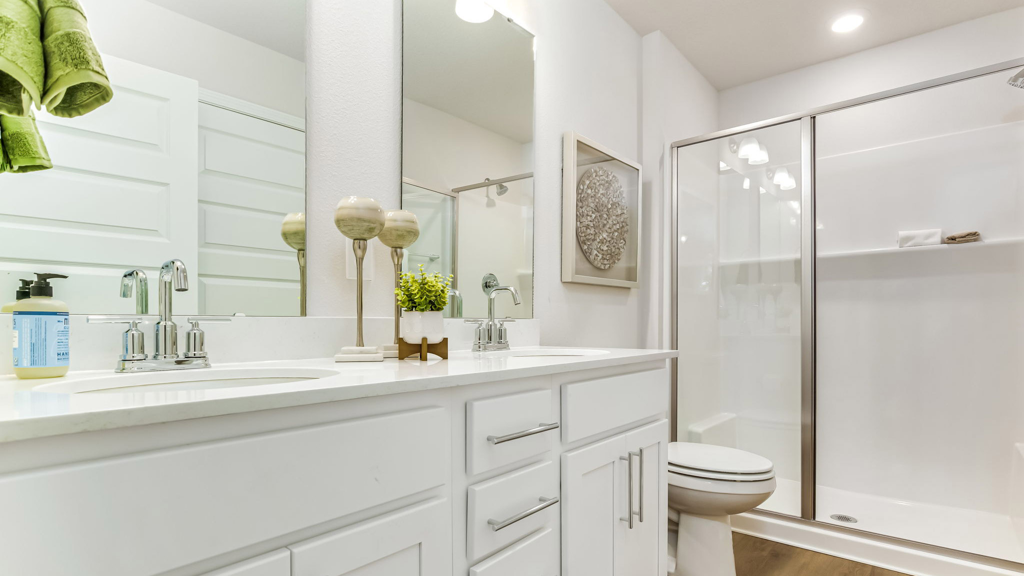 The Sabal floorplan primary bathroom wuth dual vanity and Quartz countertops