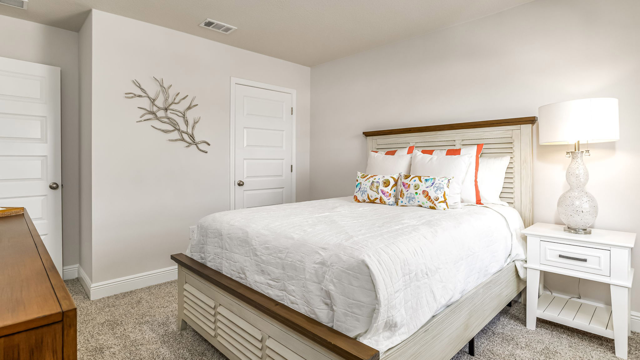 The Sabal floorplan guest bedroom one with carpet throughout