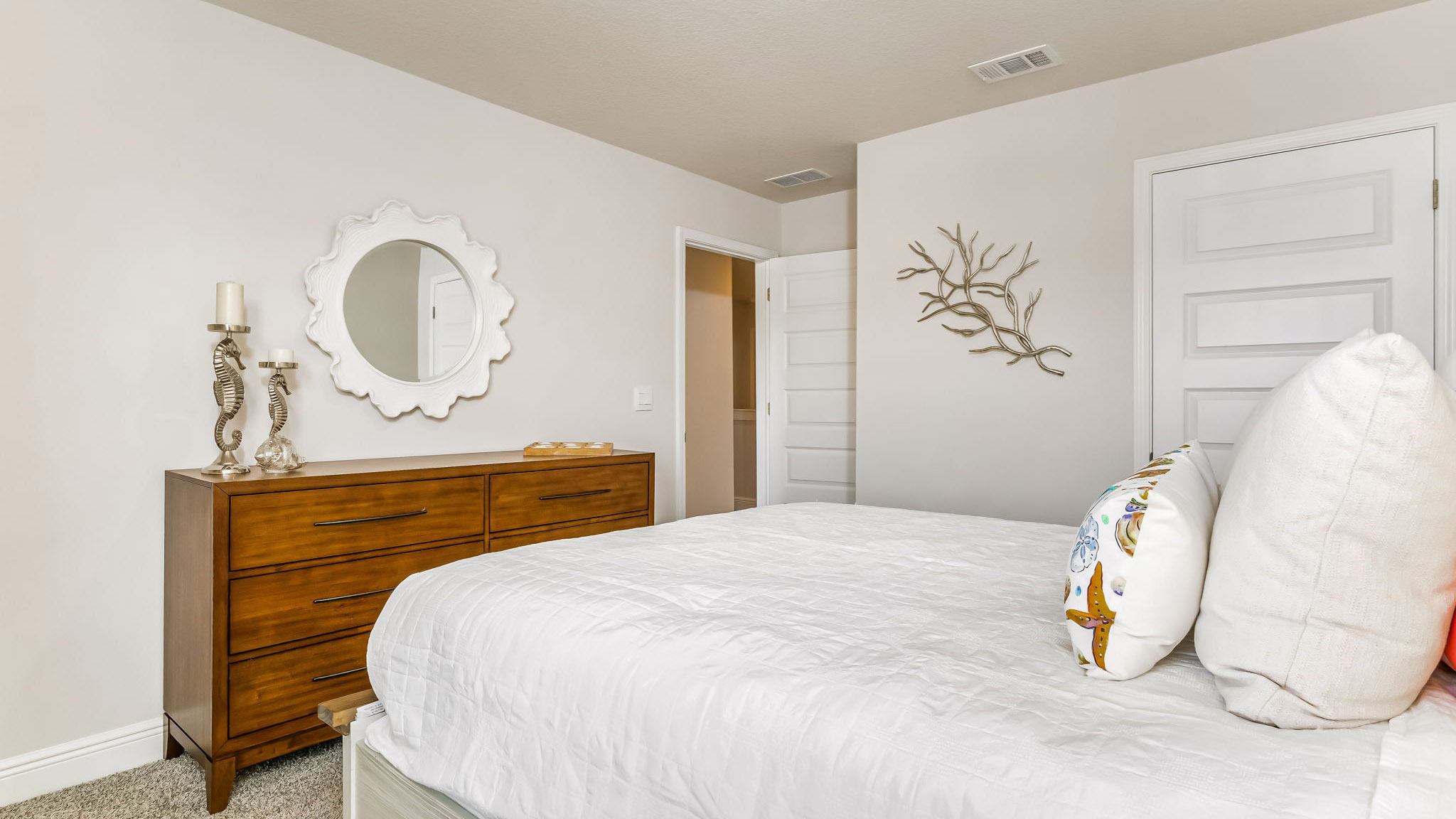 The Sabal floorplan guest bedroom one with carpet throughout