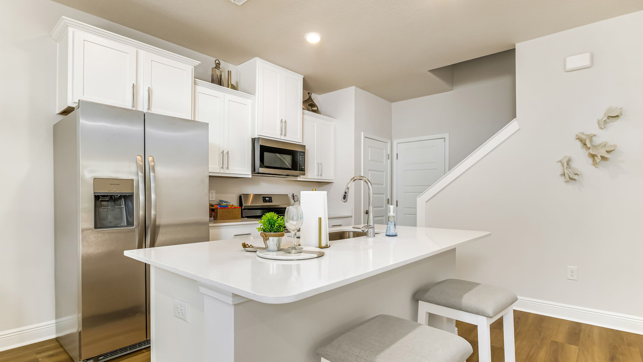 The Sabal floorplan kitchen with Quartz countertops and stainless steel appliances