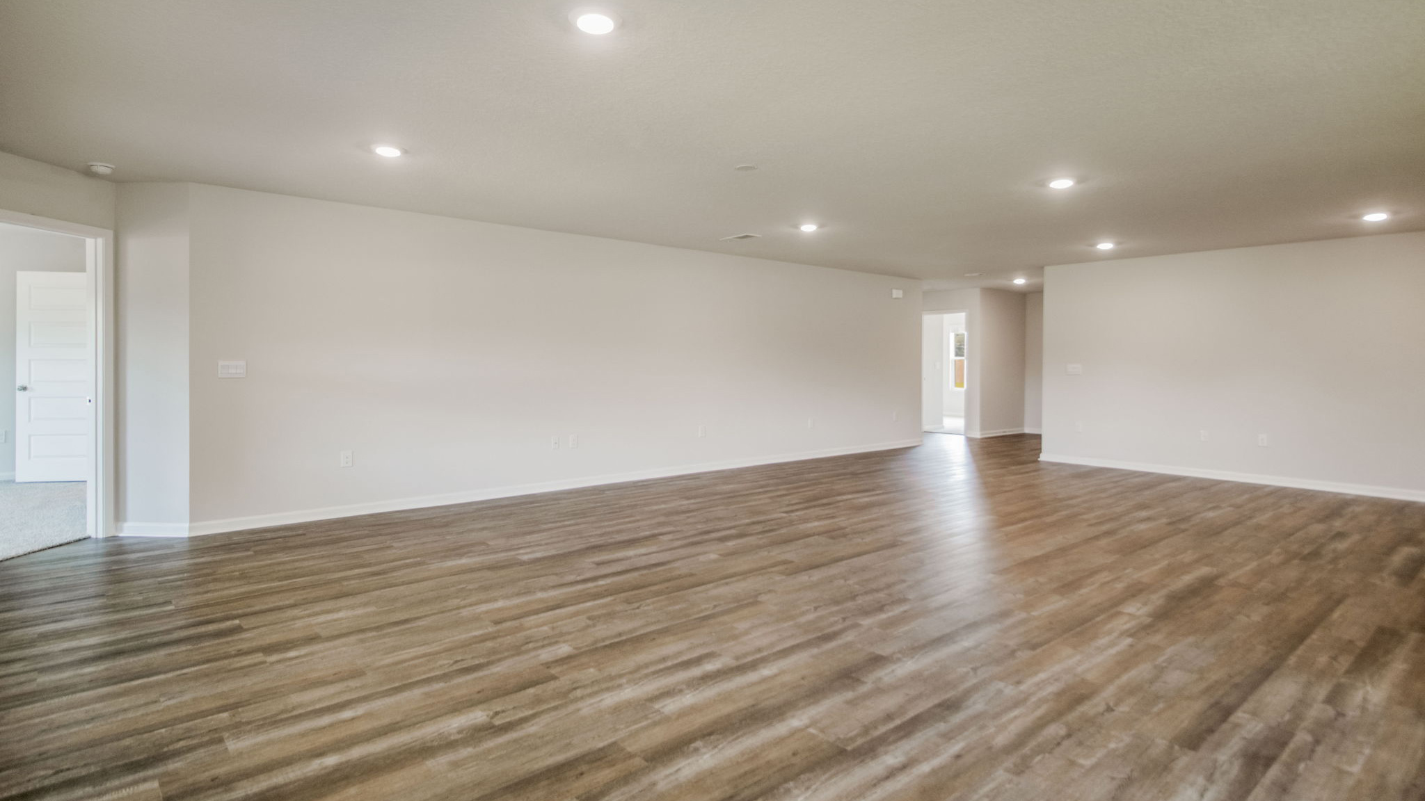 The Sawyer floorplan with an open concept main living space with EVP flooring throughout