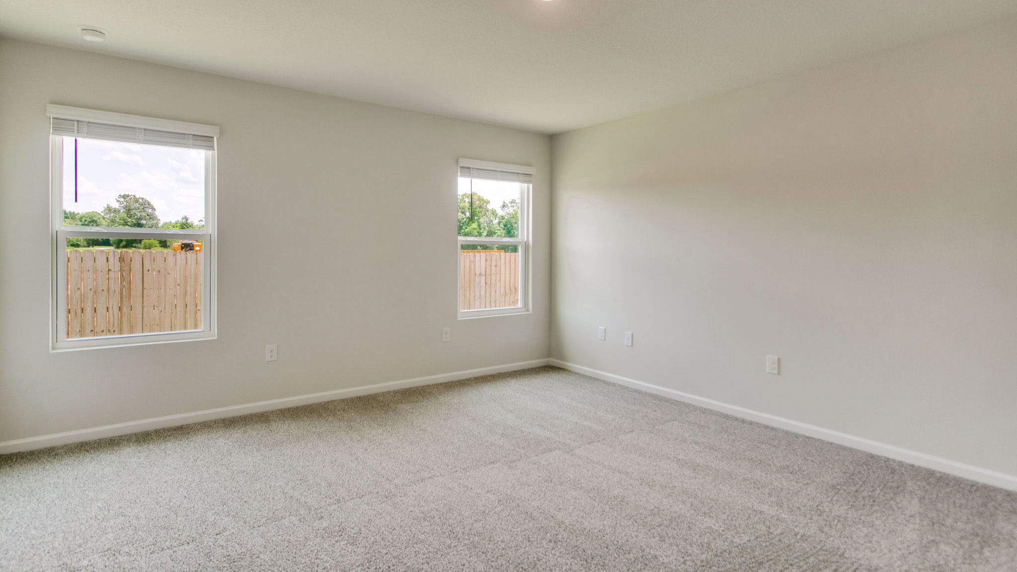 The Sawyer floorplan primary bedroom with two windows