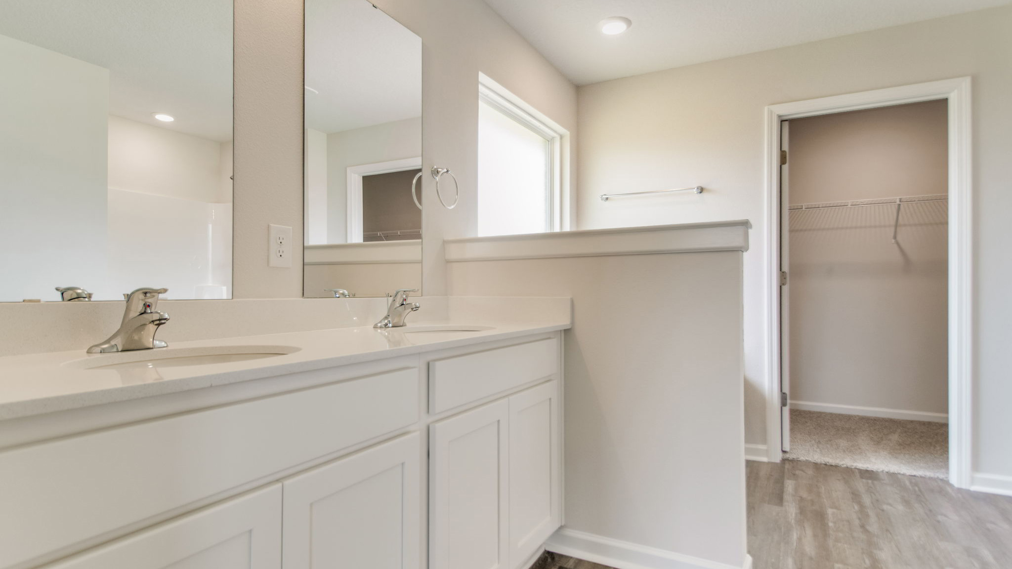 The Sawyer floorplan primary bathroom with dual vanity and quartz countertops