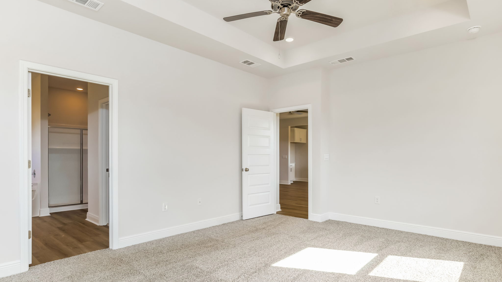 The Madison floorplan with tray ceilings and carpet throughout