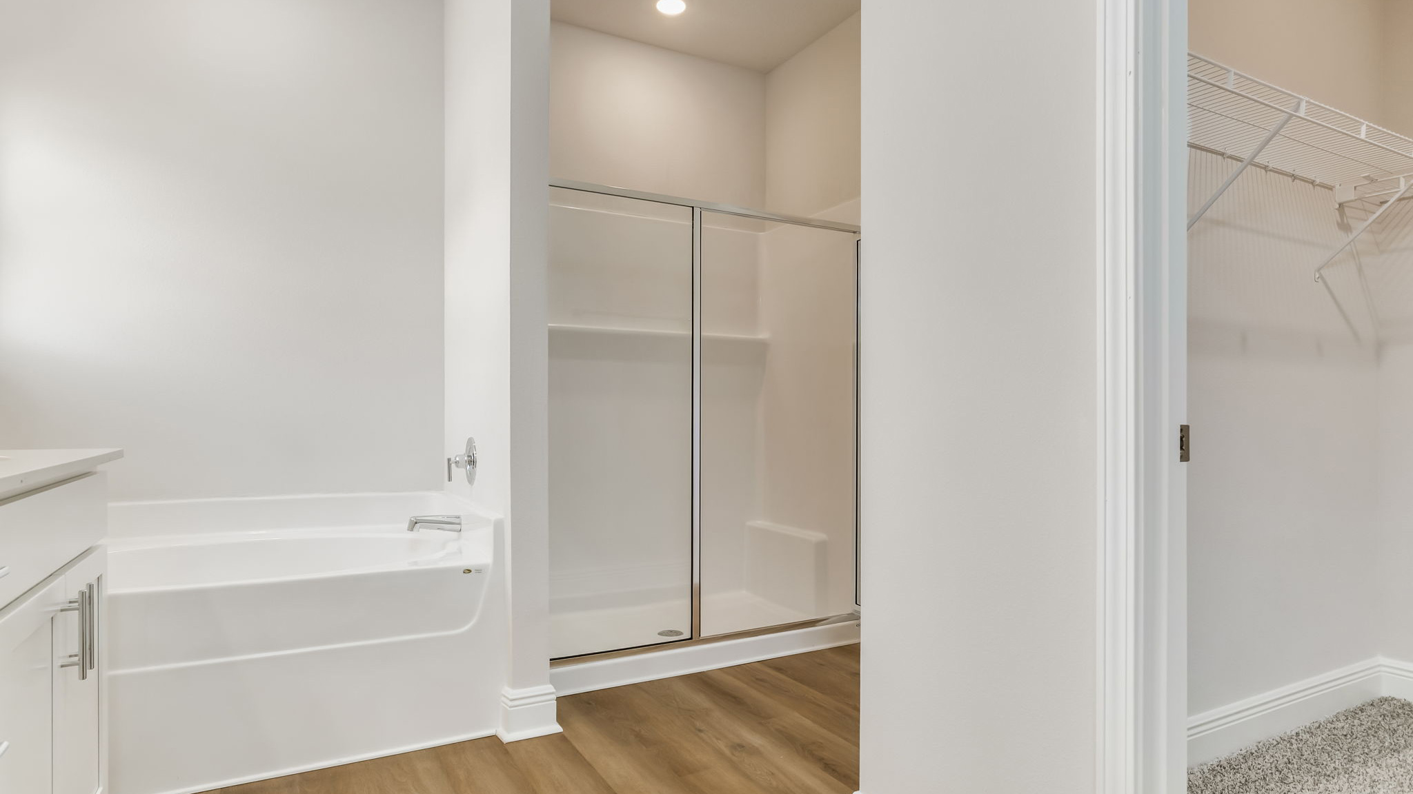 The Madison floorplan primary bathroom separate shower and tub