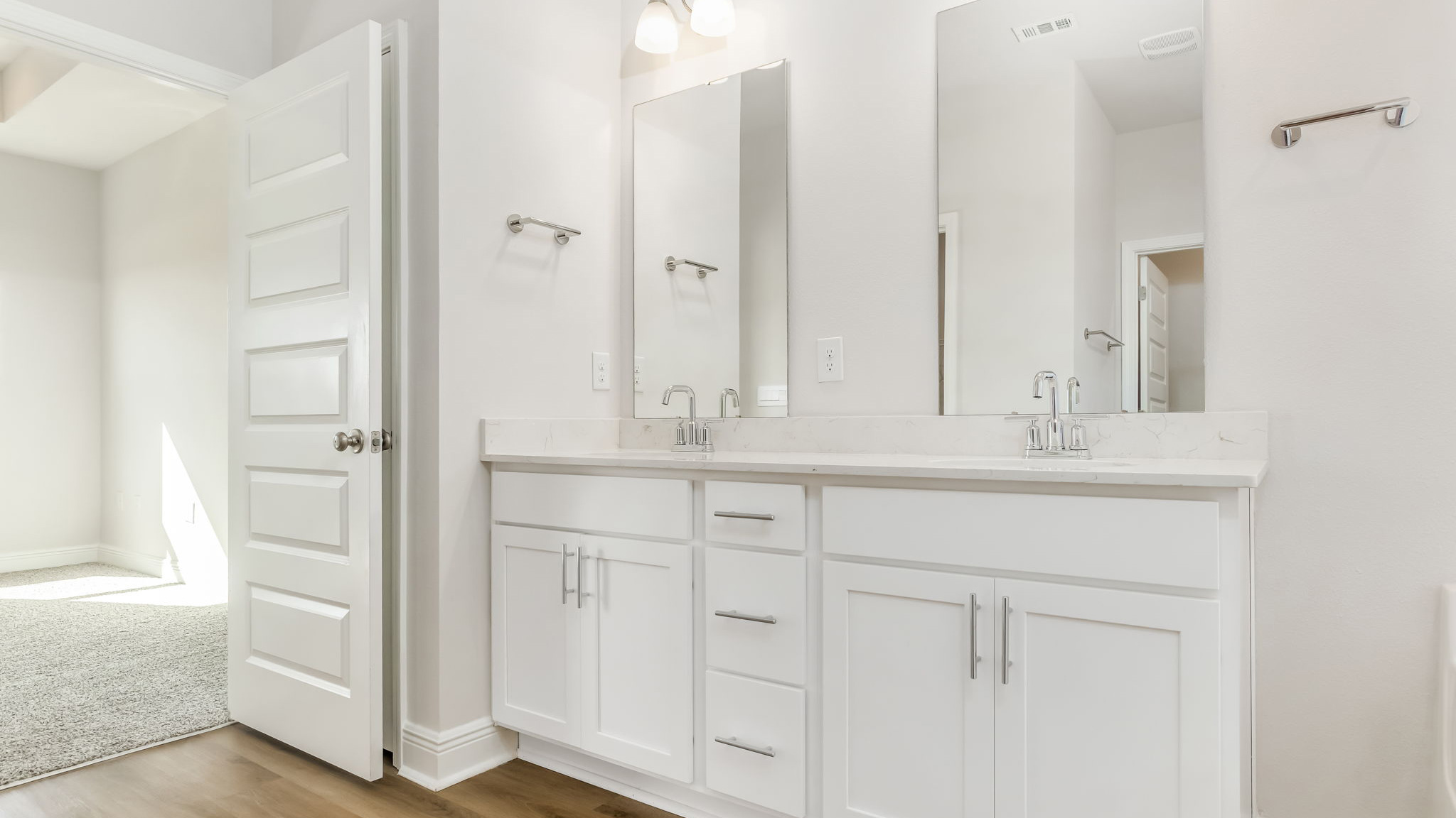 The Madison floorplan primary bathroom with dual vanity and Quartz countertops