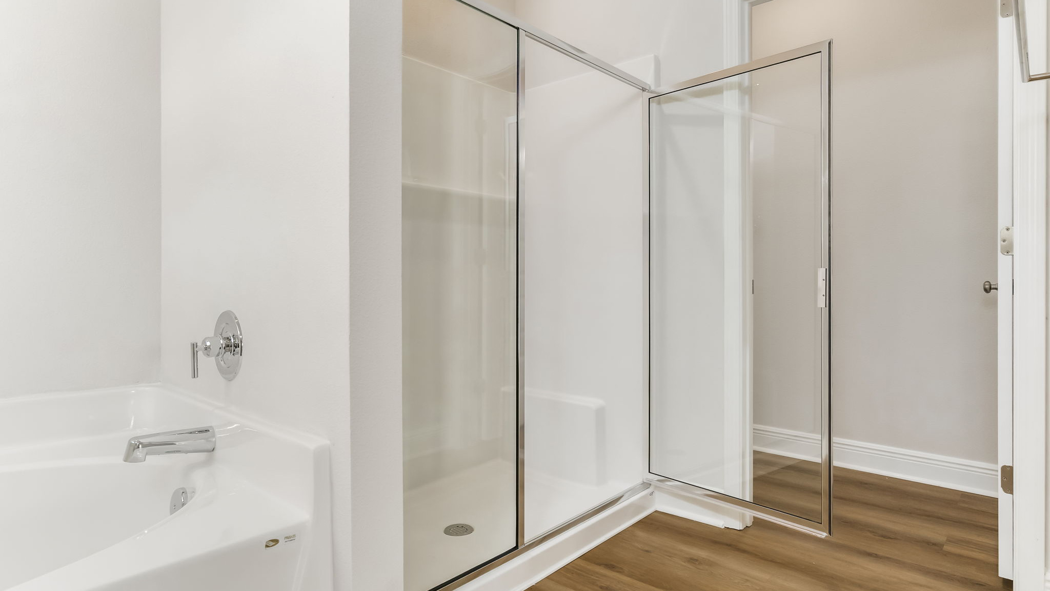 The Madison floorplan primary bathroom walk-in shower with shower door