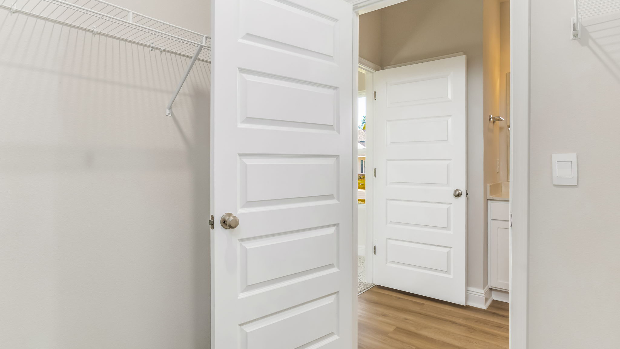 The Madison floorplan primary closet with carpet and wire shelving