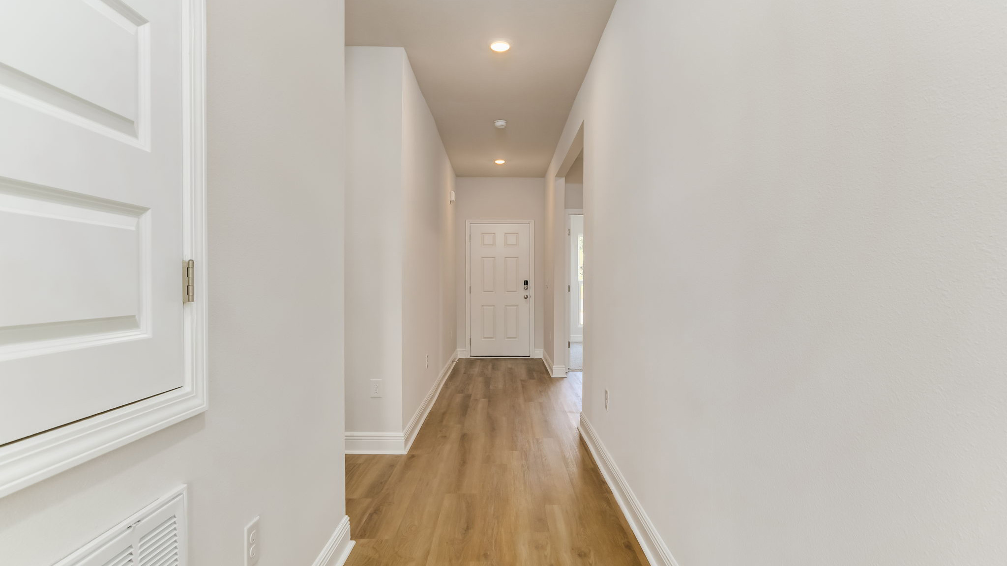 The Madison floorplan entry hallway with EVP flooring throughout