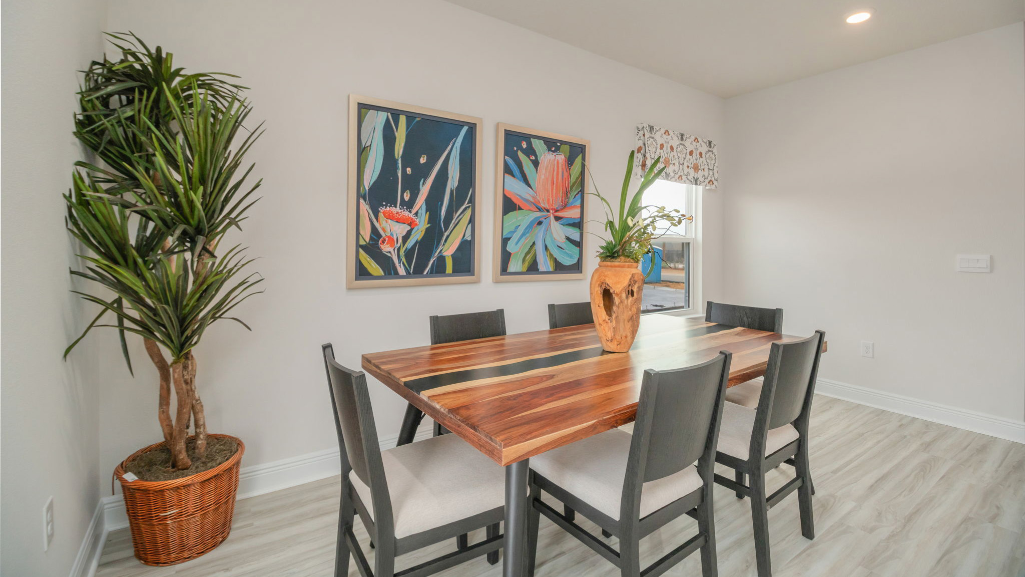 The Belfort floorplan dining room with EVP flooring throughout