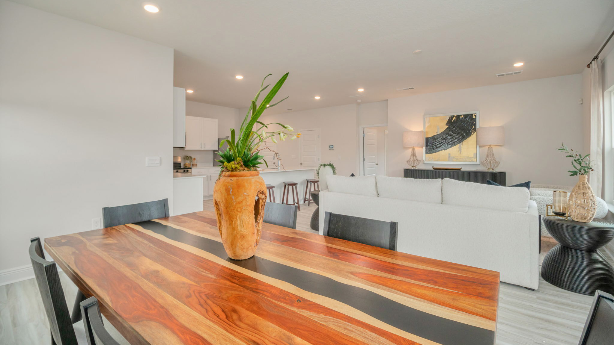 The Belfort floorplan main living space including the kitchen, dining room and living room