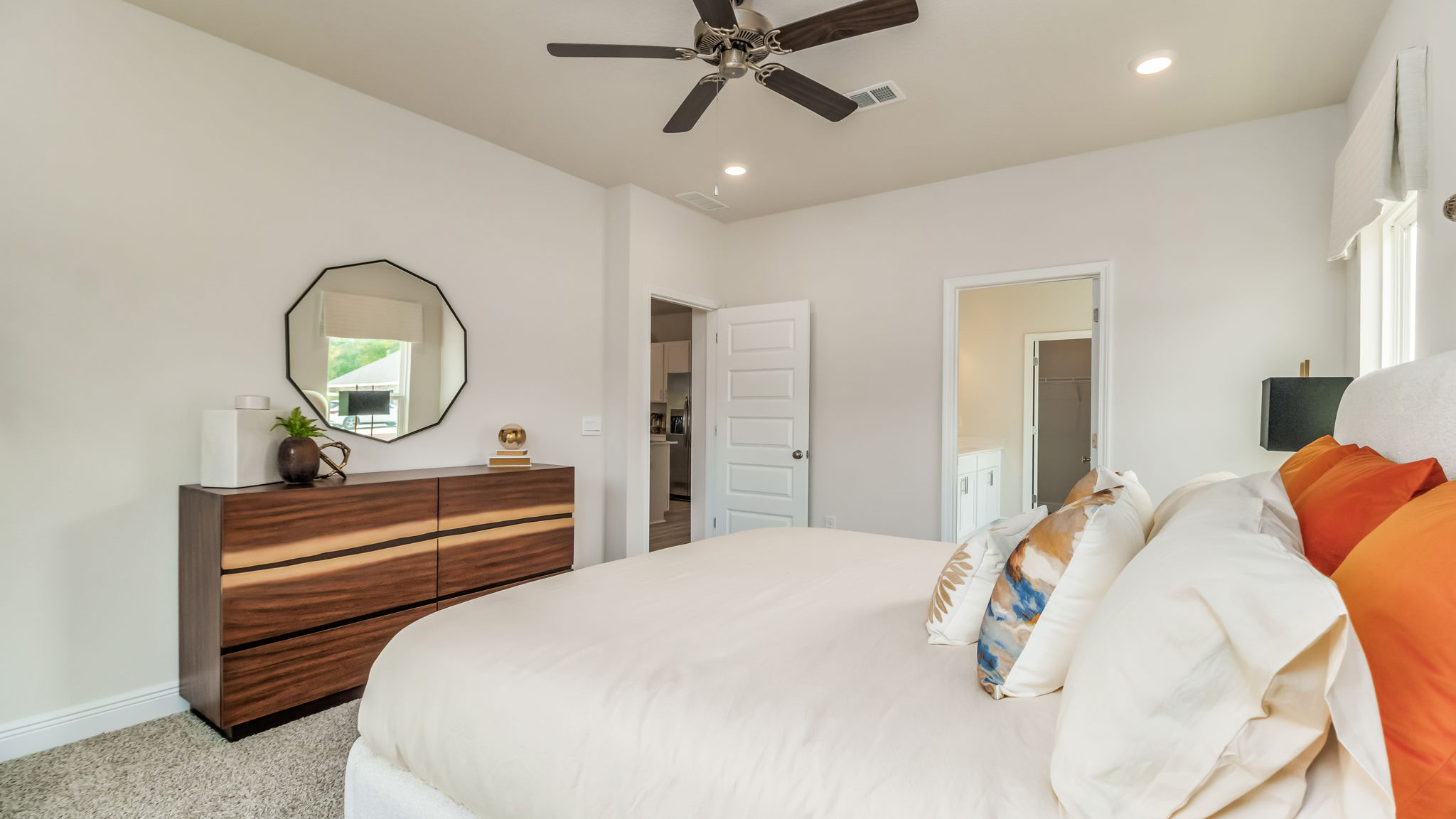 The Belfort floorplan primary bedroom with carpet throughout and 9 foot ceilings