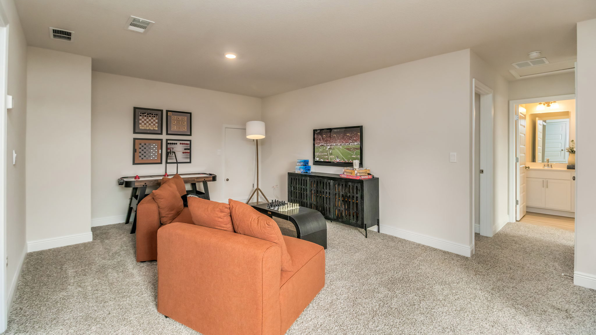 The Belfort floorplan bonus space with carpet throughout