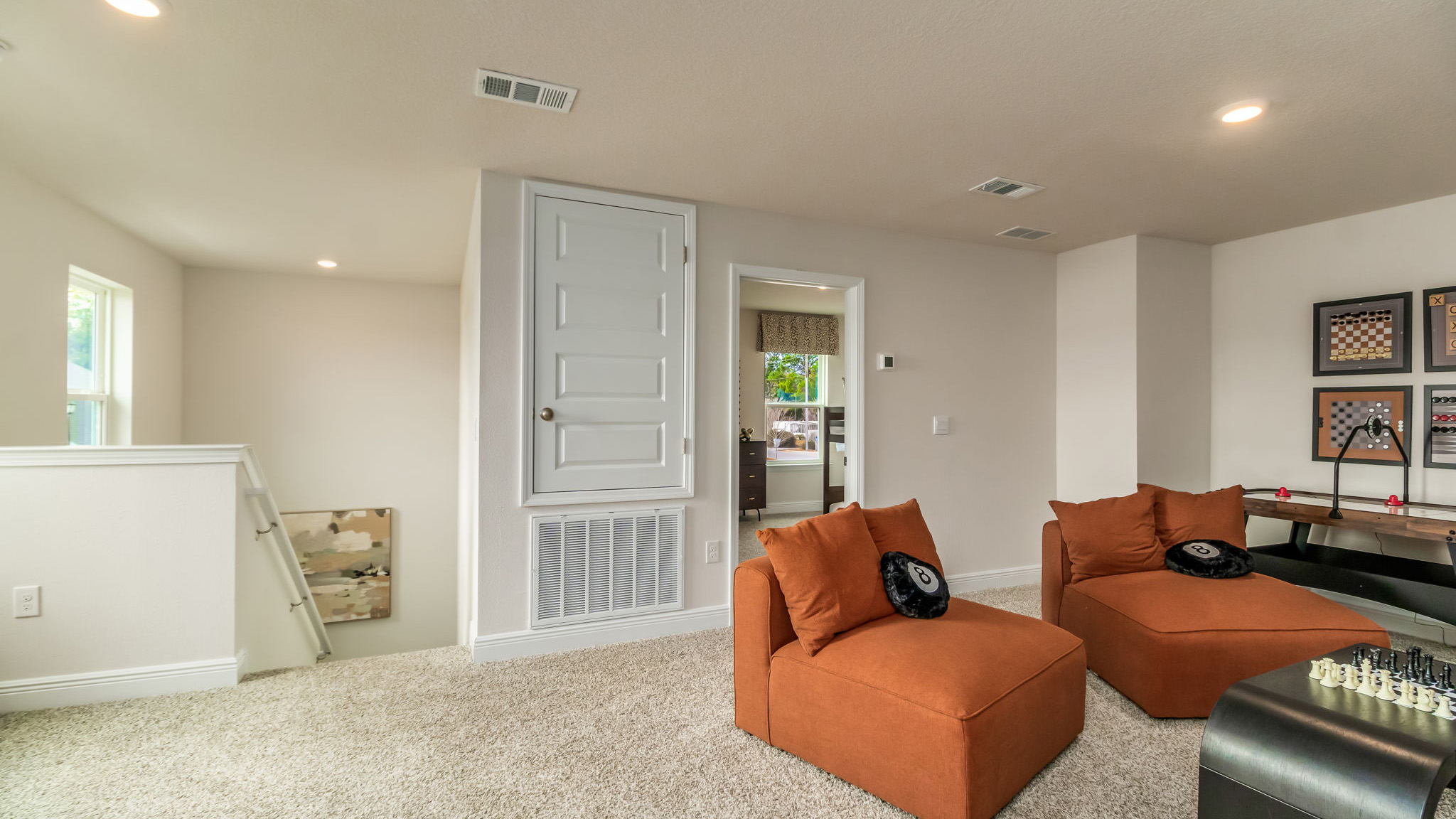 The Belfort floorplan bonus space with carpet throughout