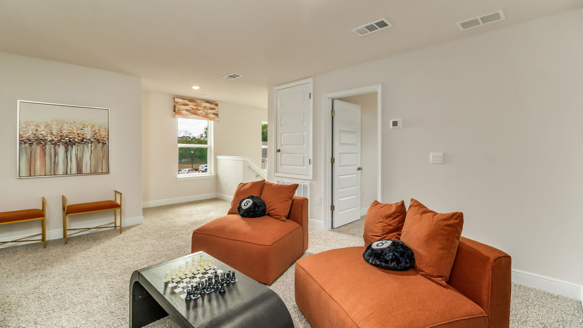 The Belfort floorplan bonus space with carpet throughout