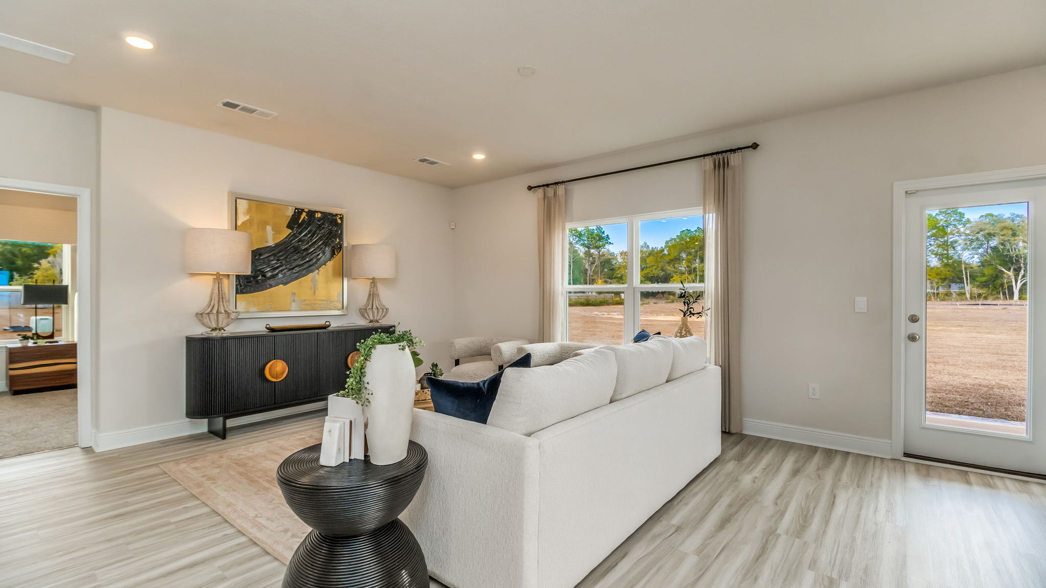 The Belfort floorplan living room with EVP flooring throughout