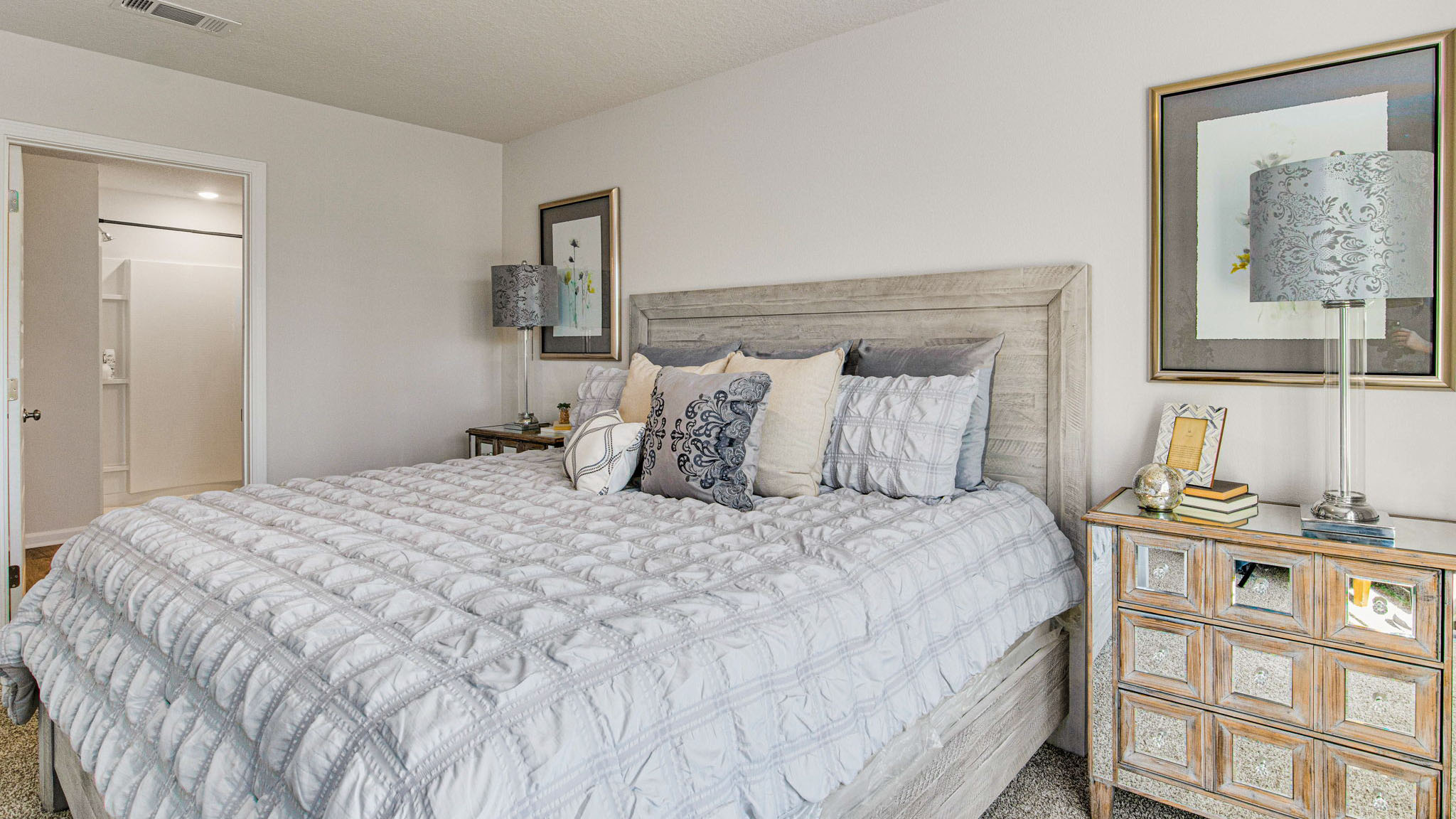 The Cali floorplan primary bedroom with carpet throughoutThe Cali floorplan primary bedroom with carpet throughout