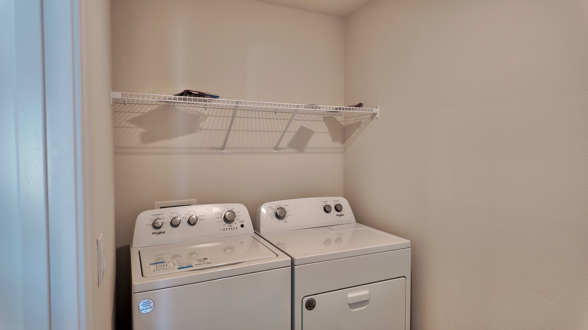 The Lismore floorplan laundry room with EVP flooring throughout