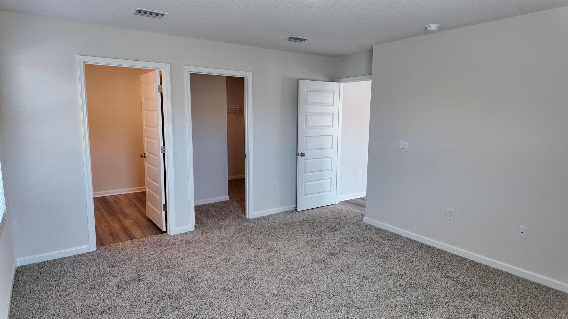 The Lismore floorplan primary bedroom with carpet flooring throughout