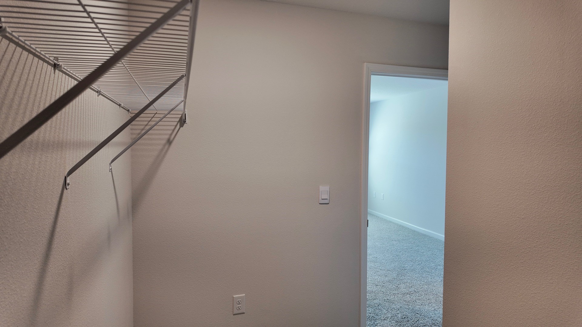 The Lismore floorplan primary bedroom closet with wire shelving