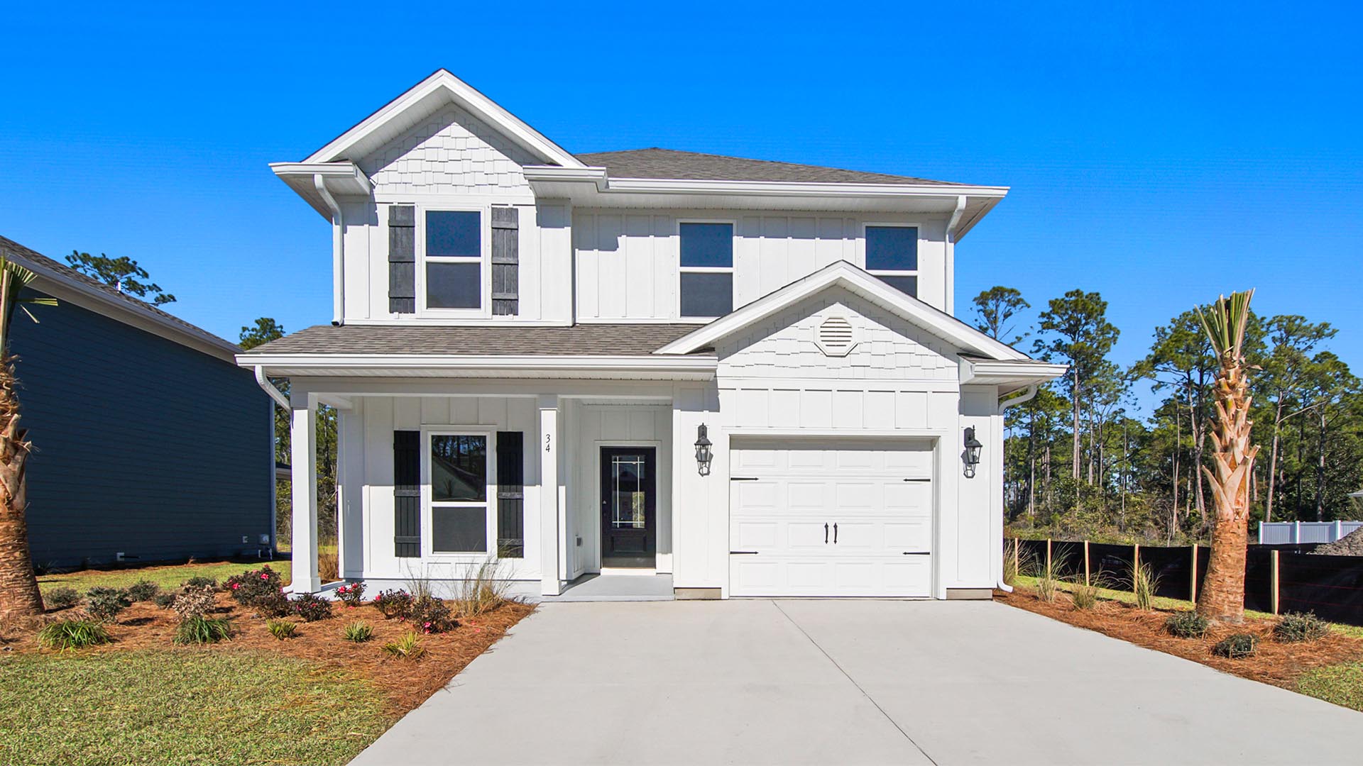 Alabaster floor plan at WindMark Beach with Hardie siding and covered front porch and single car garage.