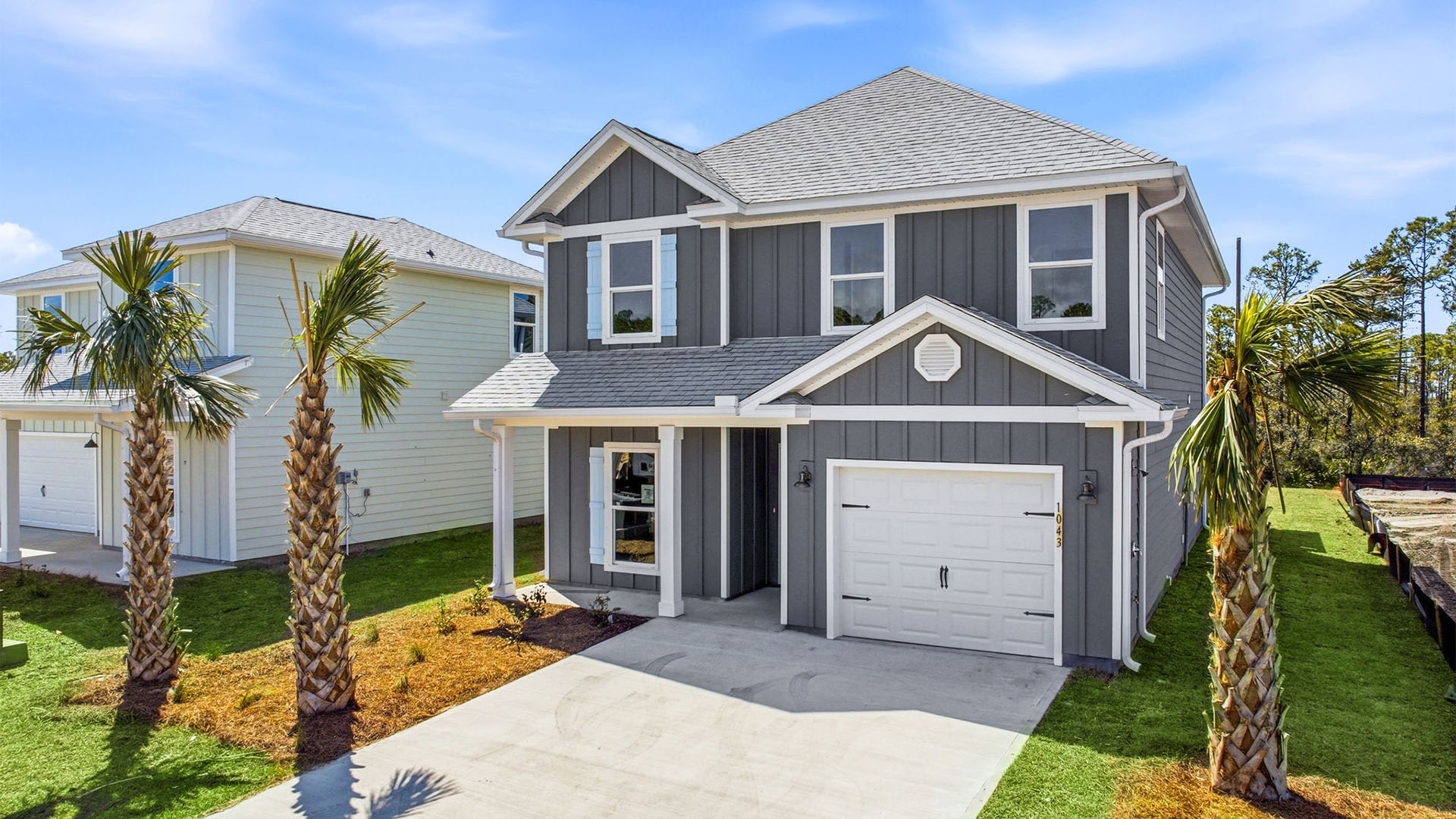 Alabaster floor plan at WindMark Beach with Hardie siding and covered front porch and single car garage.