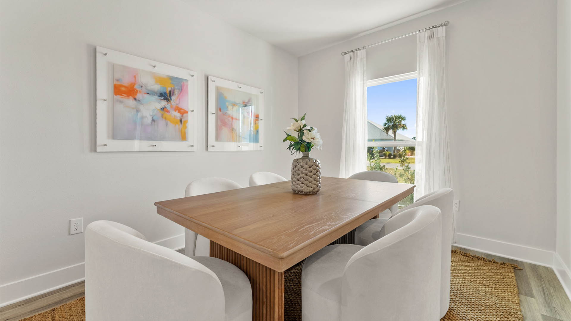 Dining room with EVP flooring and window.